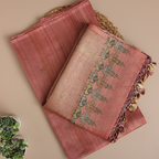Close-up view of the premium handwoven Tussar silk fabric texture in petal blush pink, showcasing the genuine weave quality.