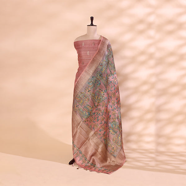 Handwoven delicate pink Tussar silk unstitched suit material displayed on a mannequin with a vibrant, multicolored hand-painted Kalamkari dupatta.