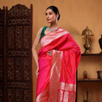 Detailed view of the pure handwoven Katan silk fabric texture and Meenakari gold zari embroidery work.
