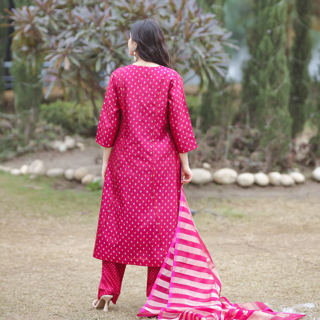 Back view of a pink handwoven Banarasi silk suit featuring gold zari bootas and a matching striped organza tissue dupatta.