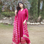 Full-length outdoor view of a pink Banarasi silk suit with gold and silver Sona Rupa motifs, showing the matching zari dot pants and striped organza dupatta.