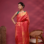 Close-up shot of the luxurious golden color heavy pallu with intricate traditional Kanjivaram motif handweaving.