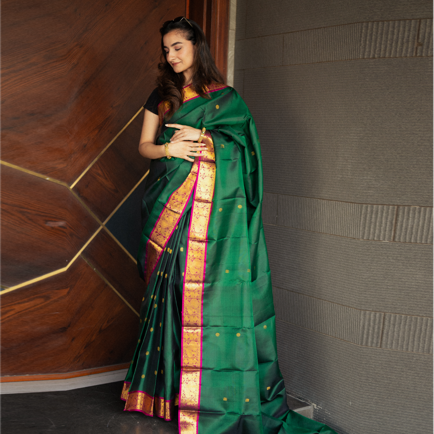 Traditional Kanjivaram saree with purple contrast border and detailed zari work