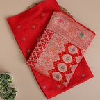 Detailed close-up of the premium Crimson Kaleidoscope pure Banarasi silk suit fabric highlighting the luxury texture and intricate traditional handloom weave.