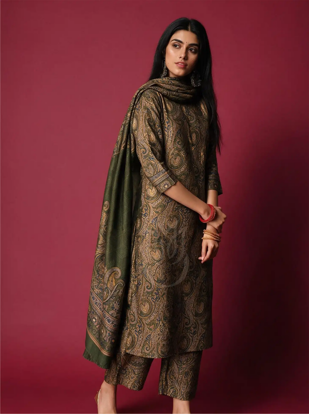 Model wearing Pure Boski Silk Olive Green Suit Set with paisley printed kurta, matching trousers, and draped olive green dupatta