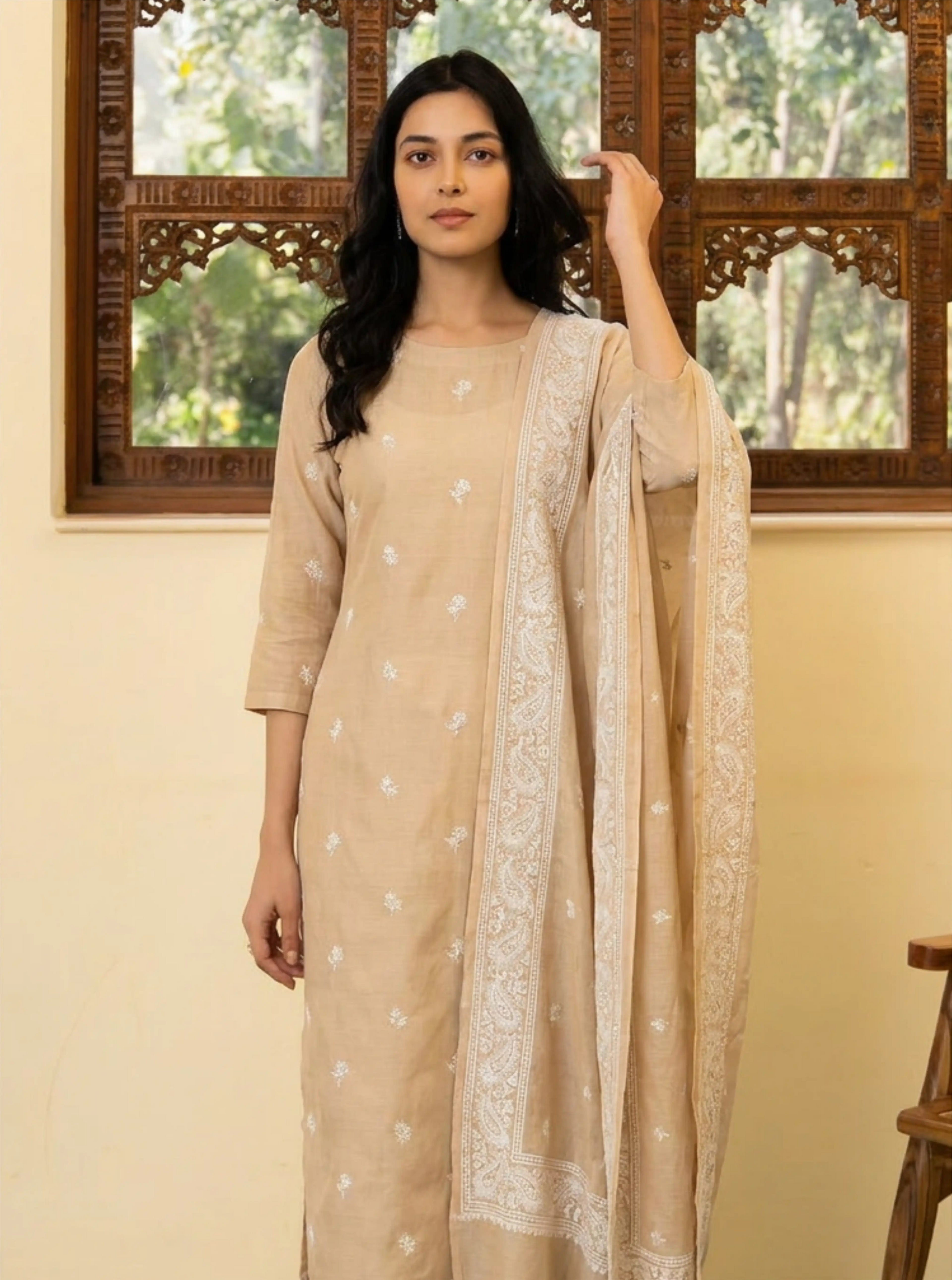Close-up shot highlighting the intricate white floral motifs and finely detailed borders on the beige Chanderi silk dupatta.