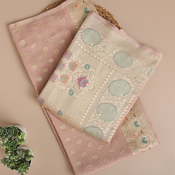 Flat lay close-up of the premium Blush Radiance pure georgette silk fabric highlighting the intricate hand-embroidered Meena and Resham work details alongside the colorful dupatta weave.