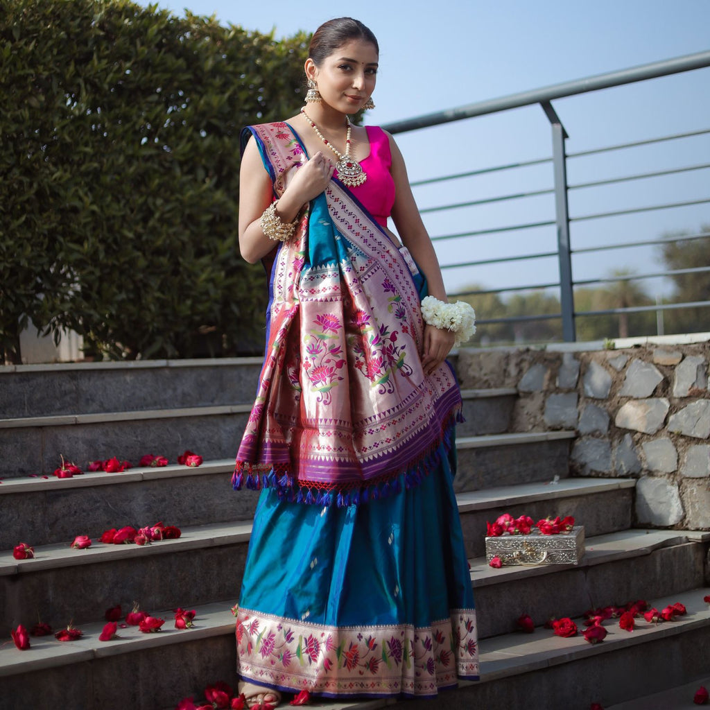 Pure Paithani katan silk saree in teal blue with floral gold border for wedding wear