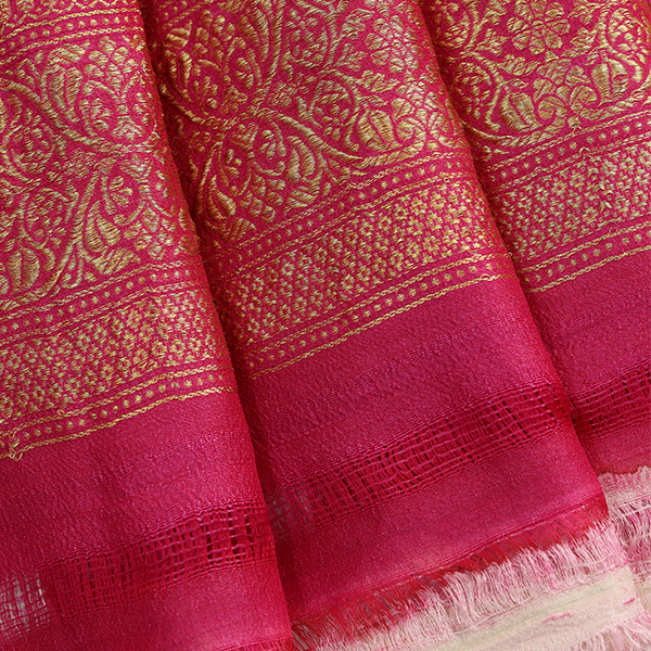Flat lay view of the unstitched pure silk blouse fabric featuring a coordinating handwoven border, included with the Celestial Azure Blush Saree.