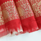Detailed look at the matching pure silk unstitched blouse material, featuring a traditional woven gold border designed to complement the heavy Banarasi saree.