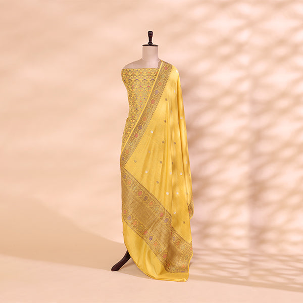 Detailed view of the radiant horizon yellow and golden dupatta paired with the handwoven Munga Silk unstitched luxury suit material.