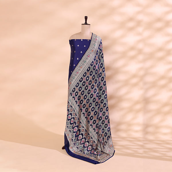 Detailed view of the radiant sunset-inspired Bandhani silk dupatta showcasing traditional tie-dye patterns in vibrant pink, purple, and blue tones with a rich border.