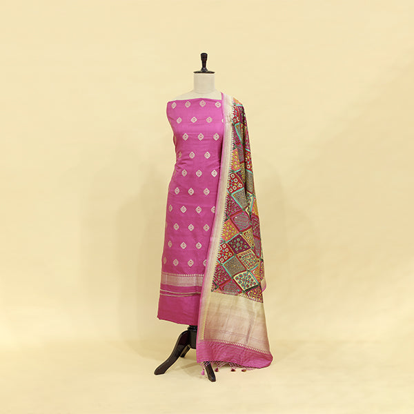 A beautiful blushing pink handwoven Banarasi silk suit paired with a vibrant, multicolored digitally printed full Jaal dupatta displayed on a mannequin.