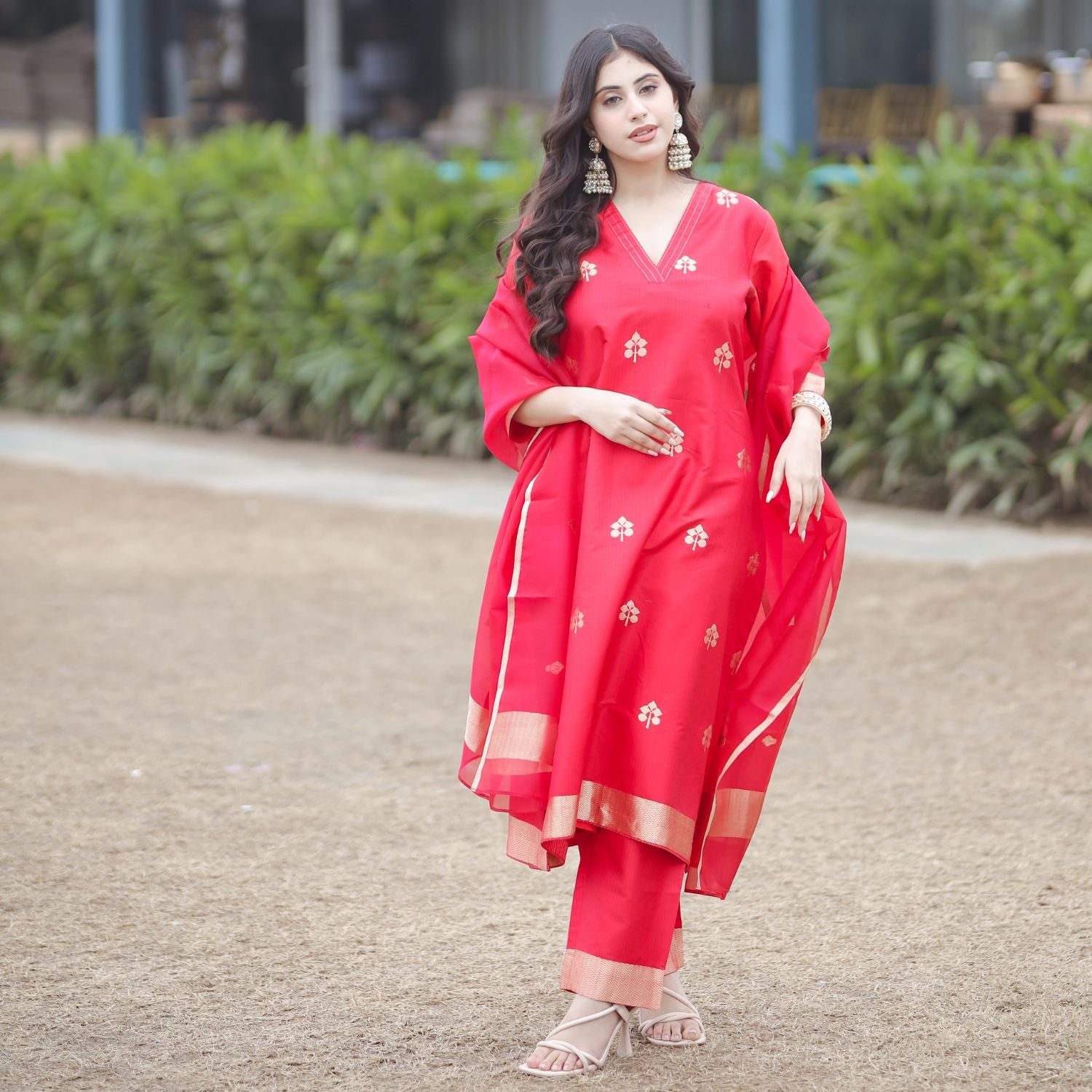 Red handwoven Banarasi silk suit with nakashi boota and elegant ethnic design