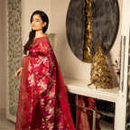 Full view of a model wearing a Red Handwoven Katan Silk Saree with gold zari floral buta and a traditional border from Arzo India.