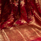 Close-up of the intricate gold zari border and floral paisley motifs on a Red Handwoven Katan Silk Saree from Arzo India.