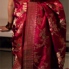 Mid-shot of a Red Handwoven Katan Silk Saree highlighting the rich gold zari work on the pallu and the intricate floral vine border.