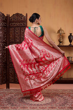 Full-length view of the crimson red pure Katan silk saree highlighting the luxury handwoven Banarasi Shikargah motifs along the pleats and border.