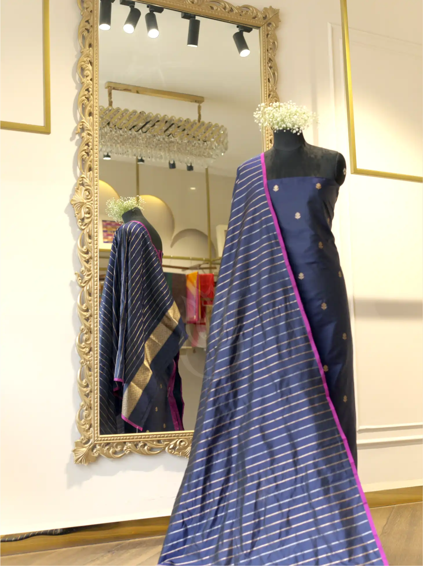 Royal blue handwoven Kora Katan silk unstitched suit fabric with gold bootis, displayed on a mannequin alongside a matching metallic gold-striped dupatta with pink edging.