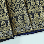 Close-up view of the Royal Blue Mashru Silk Saree showcasing the intricate abstract Jamdaani weave and the unstitched full jaal blouse fabric with a Meenakari border.