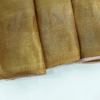 An alternate view of the Royal Crimson handwoven Khadi Tussar silk saree, illustrating the shimmering gold and silver zari patterns under natural lighting.