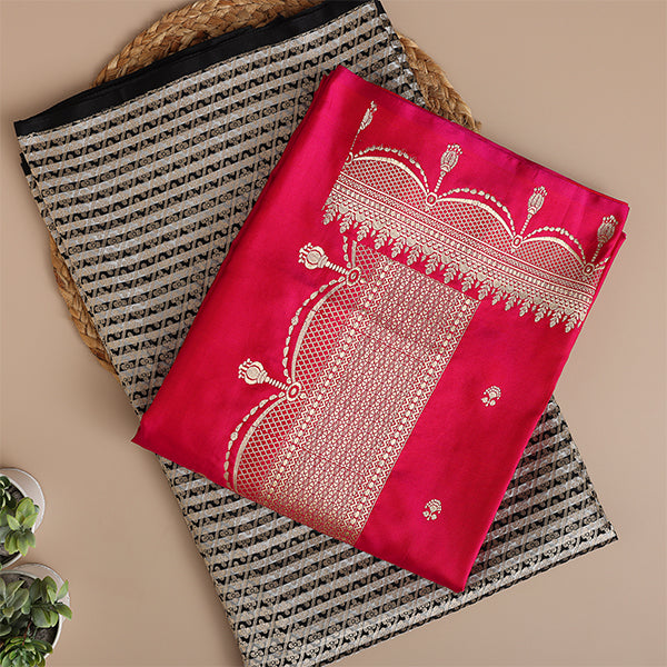 A detailed display of the premium handwoven brocade satin silk suit material showcasing the heavy, radiant gold Zari jaal embroidery design.