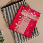 A detailed display of the premium handwoven brocade satin silk suit material showcasing the heavy, radiant gold Zari jaal embroidery design.