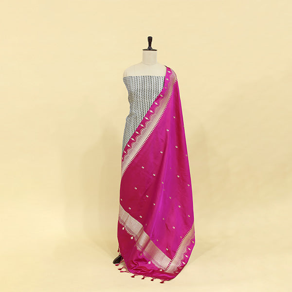 Close-up shot of the luxurious royal plum and gilded gold brocade satin silk fabric, showcasing the intricate details of the traditional handloom weaving technique.