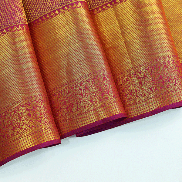 The matching regal purple unstitched Kanjivaram silk blouse piece featuring a handwoven self-jaal pattern with an elegant gold border.