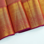 The matching regal purple unstitched Kanjivaram silk blouse piece featuring a handwoven self-jaal pattern with an elegant gold border.
