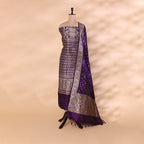 Majestic amethyst purple pure handwoven Banarasi silk unstitched suit with an intricate full Jaal design and sophisticated neck pattern, draped on a mannequin.