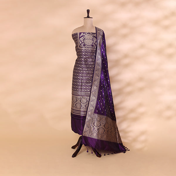 Majestic amethyst purple pure handwoven Banarasi silk unstitched suit with an intricate full Jaal design and sophisticated neck pattern, draped on a mannequin.