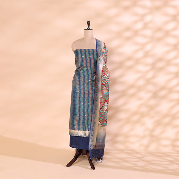 Sapphire blue handwoven Banarasi silk unstitched suit with a vibrant multicolour digital jaal print dupatta displayed on a mannequin.