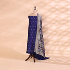 Pure handwoven Banarasi Silk unstitched suit in a vibrant sapphire blue base displayed on a mannequin, paired with a radiant sunset Bandhani dupatta featuring shades of pink and purple.