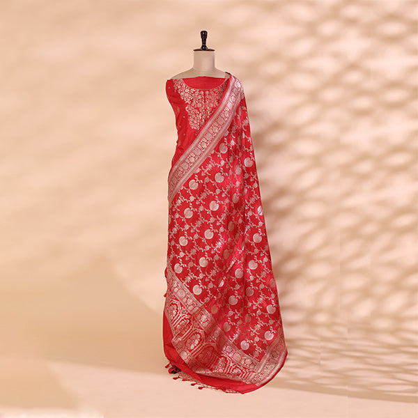 Detailed view of the premium crimson dress material highlighting the intricate traditional full Jaal handloom weave and rich silk texture.