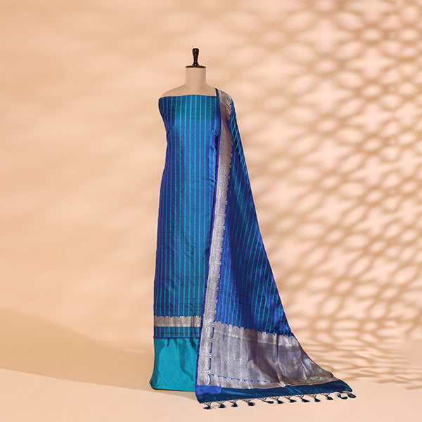 Premium handwoven Satin Silk unstitched suit in a tranquil blue shade displayed on a mannequin, featuring intricate silver resham strips and a matching silver border dupatta.