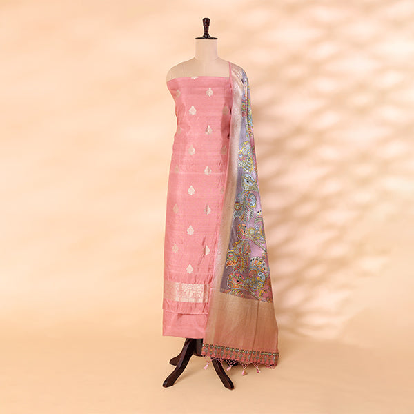 Pure handwoven Banarasi Silk unstitched suit in a serene baby pink shade displayed on a mannequin, beautifully paired with a vibrant multicolored digital Kalamkari dupatta.