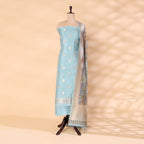 Pure handwoven Banarasi Silk unstitched suit in sky blue displayed on a mannequin, featuring an intricate traditional weave paired with a multicolored digital Kalamkari dupatta.