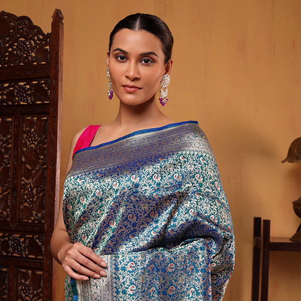 Close-up view of the heavy and opulent traditional gold handwoven pallu on the Blush Shikargah Elegance silk saree.