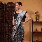 View of the 1-meter unstitched premium silk blouse material with an elegant matching border included with the Banarasi saree.