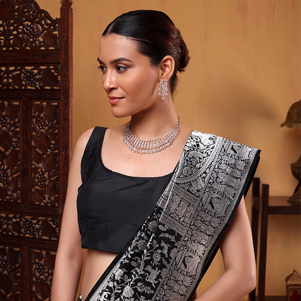 Detailed close-up of the Snowflake Elegance saree highlighting the mesmerizing handwoven Shikargah pattern in white with metallic silver Zari Jaal.
