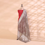 Close-up view of the sophisticated slate grey silk dupatta highlighting the intricate traditional handwoven Resham and Zari work patterns.