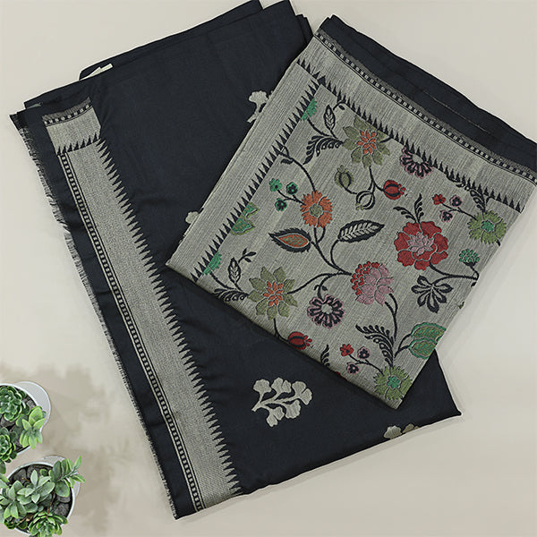 Flat lay presentation of the complete unstitched premium luxury suit set, including the slate blue handwoven Patola silk kurta fabric and festive golden dupatta.