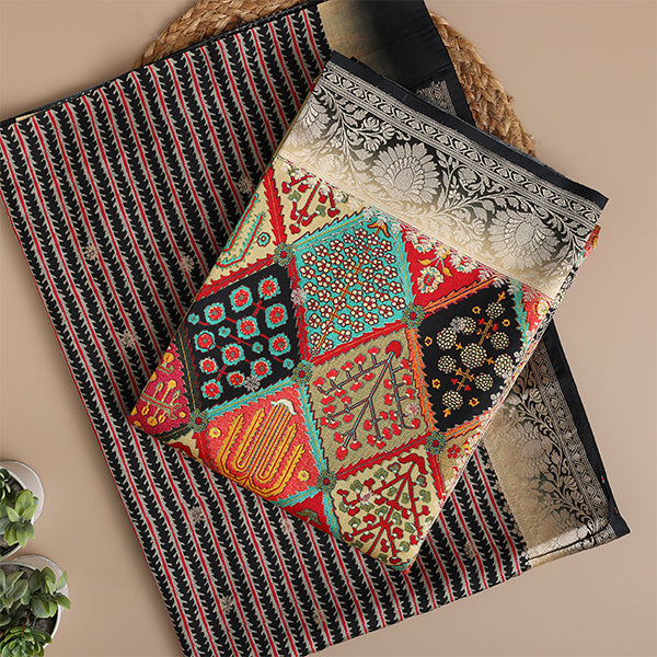 A beautiful flat-lay of a sophisticated striped fabric suit set, paired with a vibrant, multicolored traditional patchwork dupatta featuring intricate woven borders.