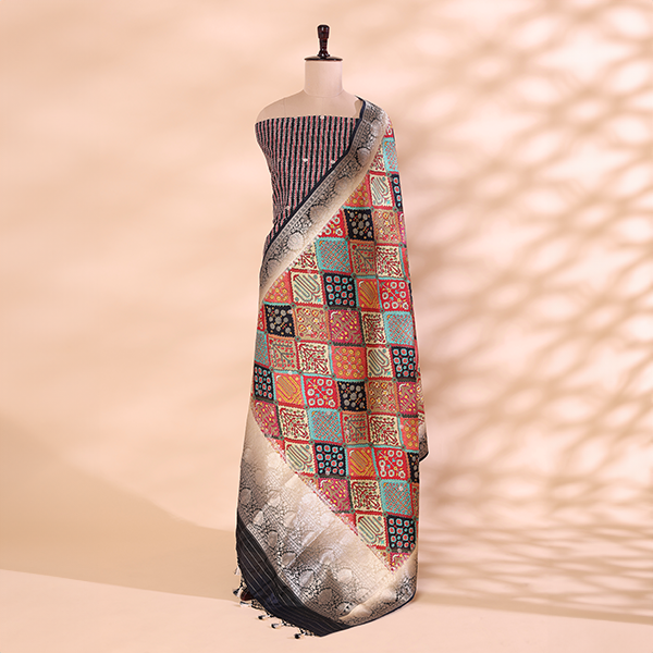 A mannequin displaying an elegant striped silk unstitched suit paired with a vibrant, multicolored traditional patchwork dupatta, featuring intricate woven borders.