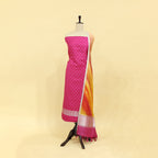 Handwoven sweet pink tie and dye silk unstitched suit displayed on a mannequin, featuring shiny silver work on the body and an enchanting multicoloured ombre dupatta.
