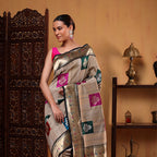 The handwoven unstitched Tussar silk blouse material featuring delicate zari bootas and an elegant resham border.