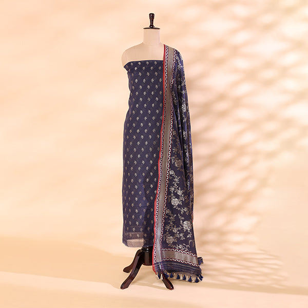 Pure handloom Cotton Mull Jamdani unstitched suit featuring a twilight plum base displayed on a mannequin with a vibrant, radiant prismatic dupatta.