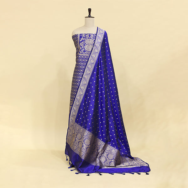 A vivid azure blue Banarasi silk suit featuring an intricate full Jaal design and an elegant neck pattern, displayed on a mannequin.